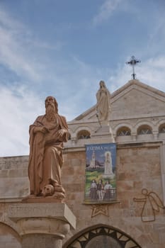 Bethlehem, Palestine, Israel - October 24, 2017: A statue of Saint Hieronymus outside The Church of the Nativity which is a basilica located in the West Bank of Bethlehem.