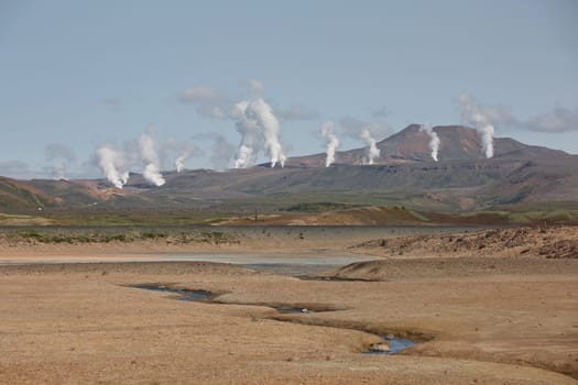 Námaskarð. Fumarole field in Namafjall, Iceland. Namaskard geothermal beauty landscape with mud pools and steam. Icelandic brown landscape. Landscape which pools of boiling mud and hot springs.