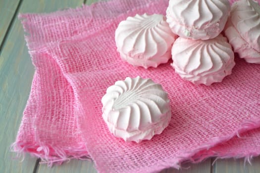 White and pink zefir or zephyr on vintage wooden table