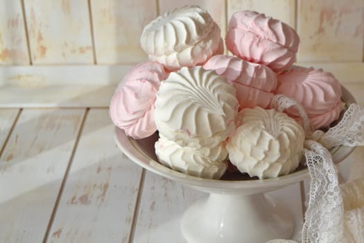 marshmallow is zephyr on a light shabby wooden background