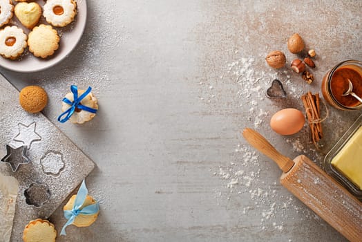 Making and baking cut-out sugar cookies of all shapes and sizes. Holidays, celebration and cooking concept.