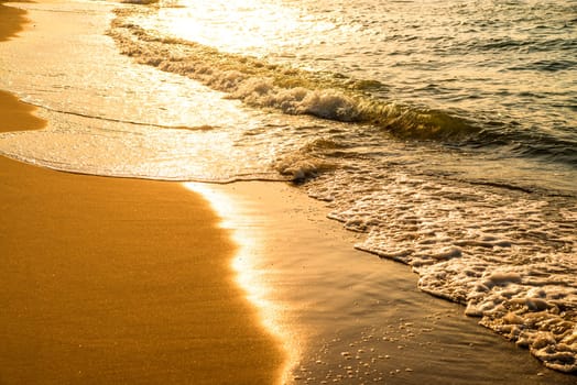 surf of the Baltic sea with evening sun