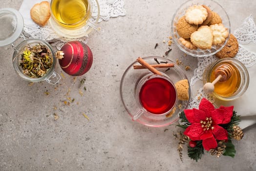 Winter drinks with mulled red wine and herbal tea. Traditional hot drinks at winter holidays time