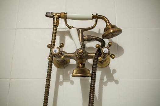 Antique Copper style bath tube faucet. Selective focus
