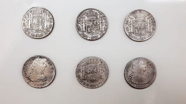Cartagena, Spain - September 14th, 2018: 6 Silver spanish pieces of eight. ARQUA Museum, Spain