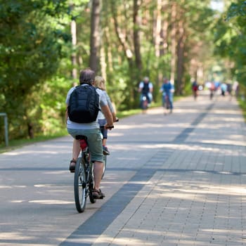 Bicyclists on the dune road between Ahlbeck in Germany and Swinoujscie in Poland
