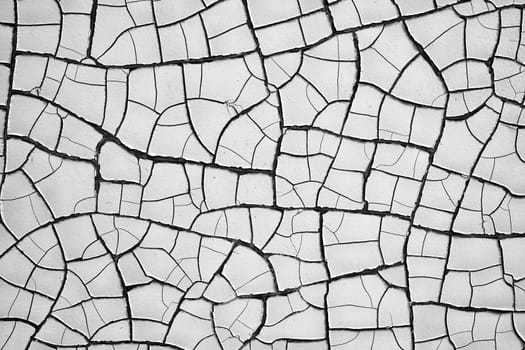 Cracks in the paint coat on a facade