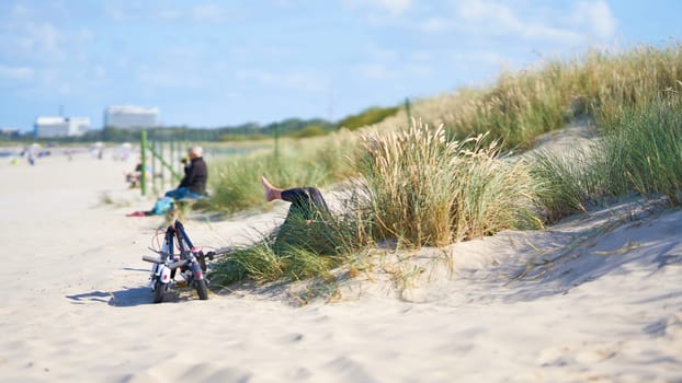 Relaxing on a summer day on the beach of Swinoujscie on the Polish coast of the Baltic Sea