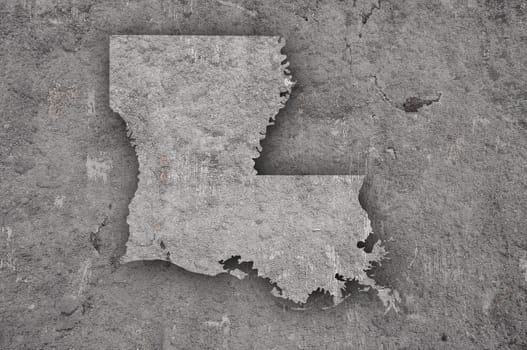 Map of Louisiana on weathered concrete