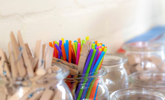 Colorful drinking straws and clothespins as a calculation aid in a primary school with copy space