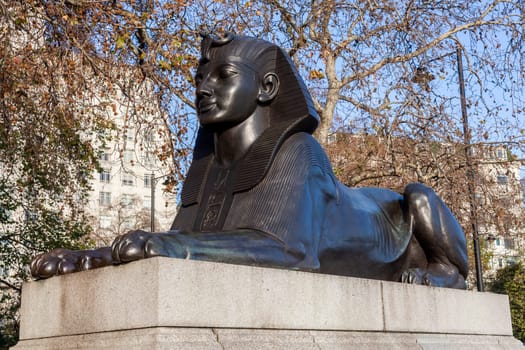 One of two Sphinx guarding Cleopatra's Needle on Victoria Embankment in London England UK erected in 1878 and is a popular tourist travel destination attraction landmark, stock photo image