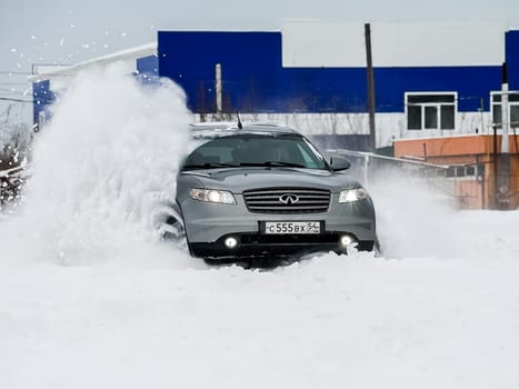 Moscow, Russia - January 24, 2019: Car infiniti QX70, winter photos of the car when driving through snowdrifts.