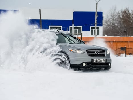 Moscow, Russia - January 24, 2019: Car infiniti QX70, winter photos of the car when driving through snowdrifts.