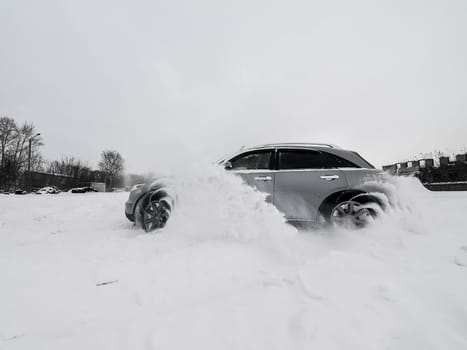 Moscow, Russia - January 24, 2019: Car infiniti QX70, winter photos of the car when driving through snowdrifts.