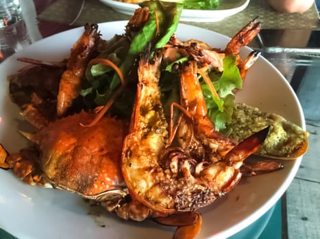 Boiled crab, shrimp and oysters. Lunch at the restaurant.