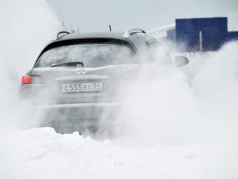 Moscow, Russia - January 24, 2019: Car infiniti QX70, winter photos of the car when driving through snowdrifts.