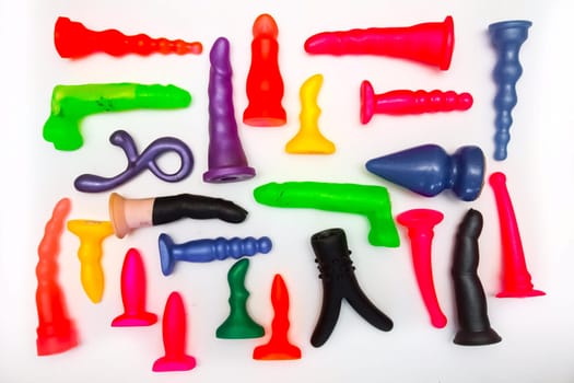 Sex toys on a white background. Products of a rubber products factory for a sex shop