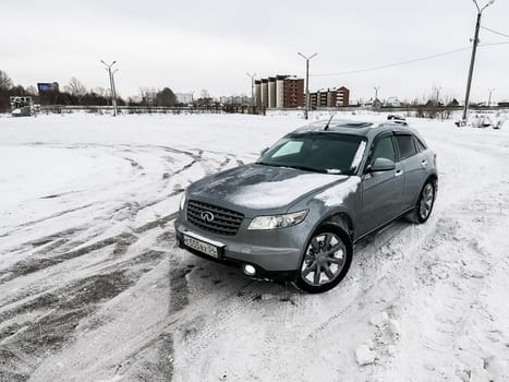 Moscow, Russia - January 24, 2019: Car infiniti QX70, winter photos of the car when driving through snowdrifts.
