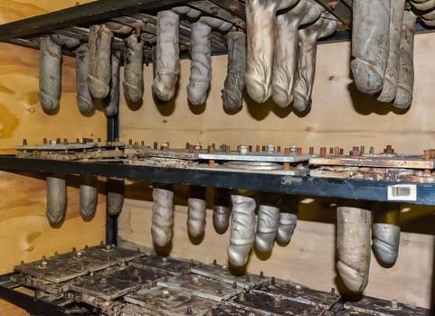Processing of rubber products for sex shop on the machine. Mold for the product. Rubber penis