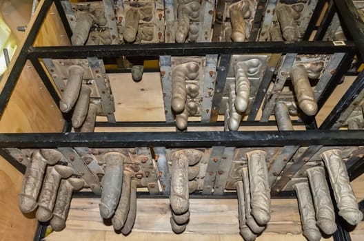 Processing of rubber products for sex shop on the machine. Mold for the product. Rubber penis