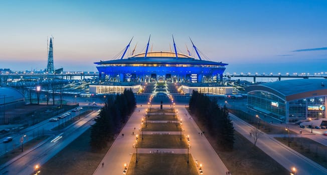 The roof of the stadium at night. Stadium lights.