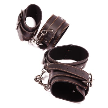 Black leather handcuffs. A toy for BDSM.