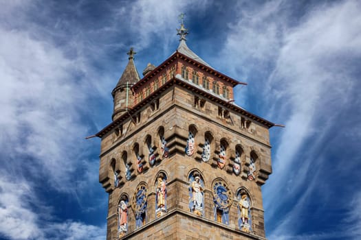 The clock tower of Cardiff Castle Wales UK completed in 1873 which is part of the wall of the 12th century Norman fort which is a popular tourism travel destination attraction landmark of the city