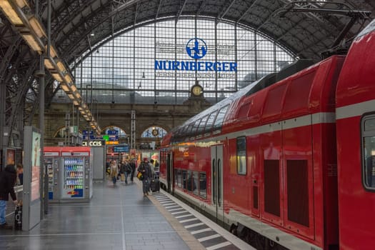 Trains and unidentified passengers in the central station of Frankfurt am Main, Germany