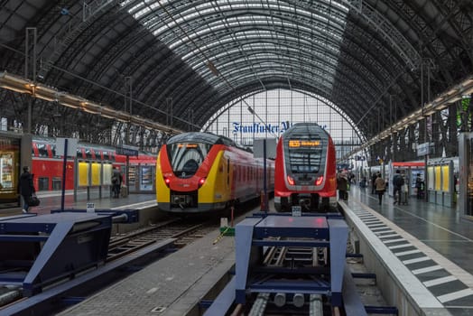 Trains and unidentified passengers in the central station of Frankfurt am Main, Germany