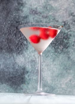 Glass of Dry Martini with red olives