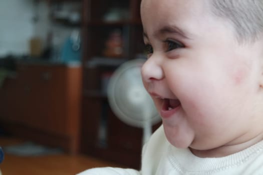 Baby girl with lovely face, big eyes and cute face gesture. Toddler baby making sweet activities