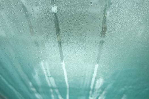 Bright grey color glassy texture, with water drops on it. Water drop glassy background
