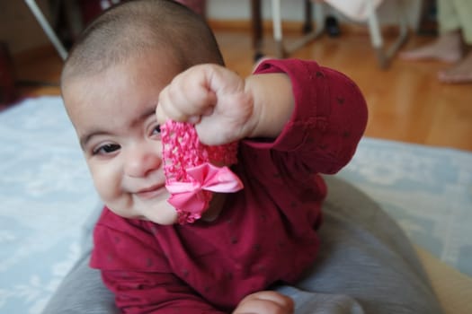 Portrait of a baby girl with smiling face, big eyes and lovely face gesture