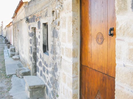 Portal with wood carvings in Sardinia, Italy.
