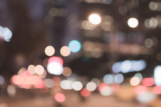 Abstract urban background with blurred buildings and street, shallow depth of focus.