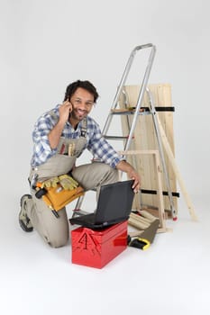 Carpenter answering telephone call