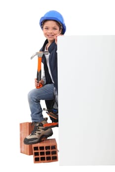 Girl pretending to be a construction worker