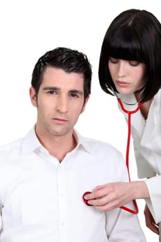 nurse examining a patient