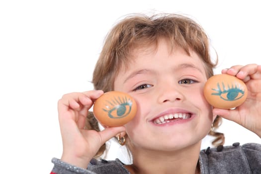 Girl with painted eggs