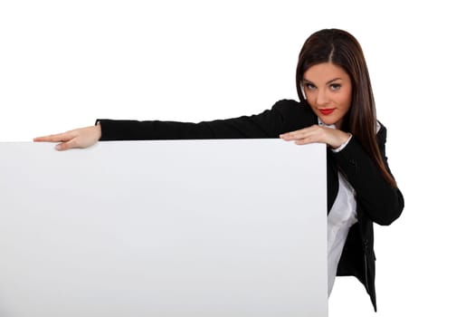 Sexy girl holding white panel