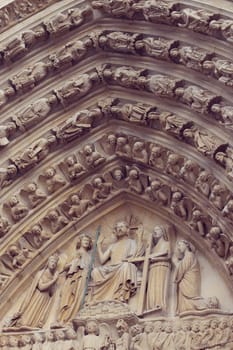 Architectural details of Cathedral Notre Dame de Paris. Cathedral Notre Dame de Paris - most famous Gothic, Roman Catholic cathedral on the eastern half of the Cite Island. France, Europe.