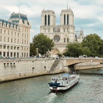 Paris, Notre Dame  with boat on Seine, France