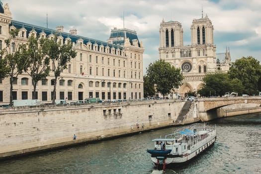 Paris, Notre Dame  with boat on Seine, France