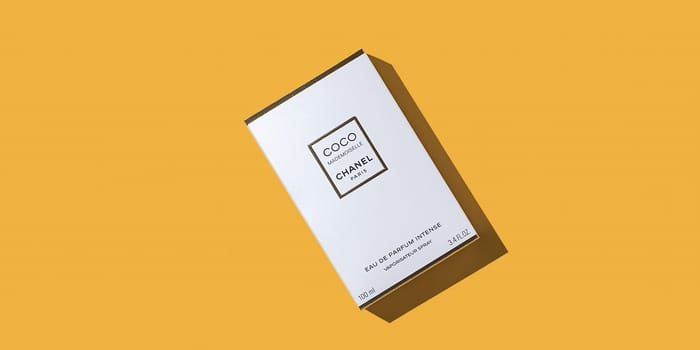 A box of Chanel perfume on a uniform yellow background. Women's perfume series Coco Chanel. 2020-07-05 Samara. Layout, layout, advertising, mockup.