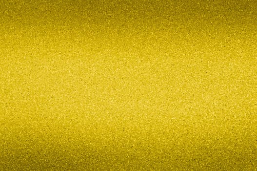 Granite background of golden color with small dots. Darkening.