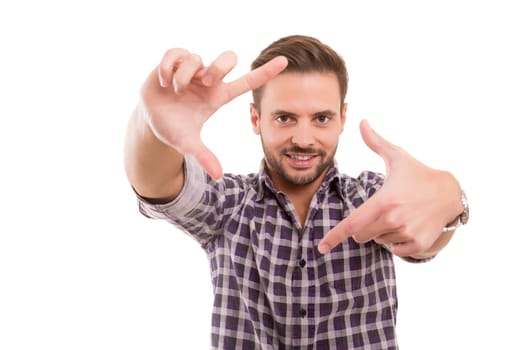 Young man making framing key gesture - isolated over white