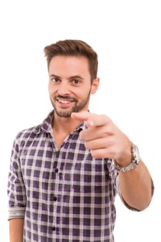 Handsome young man pointing at you, isolated over white background