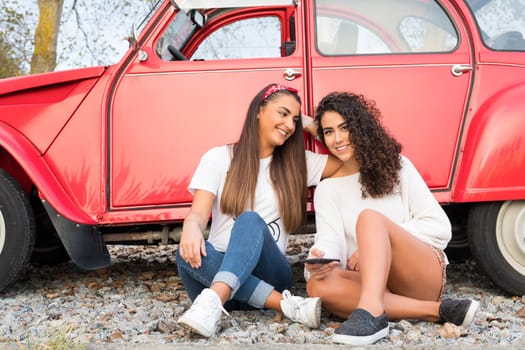 Two friends going on a roadtrip through countryside