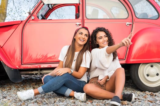 Two friends going on a roadtrip through countryside
