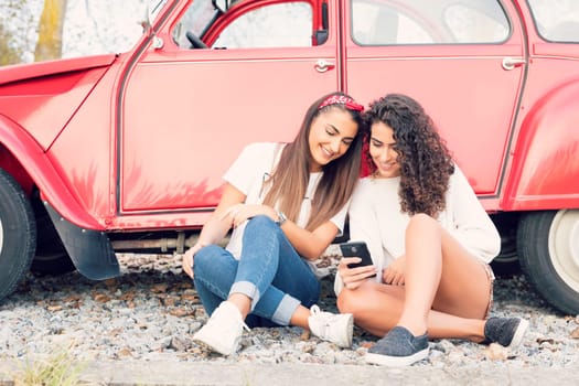 Two friends going on a roadtrip through countryside